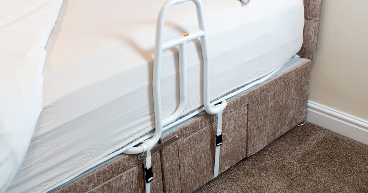 Bed rail for slatted base top